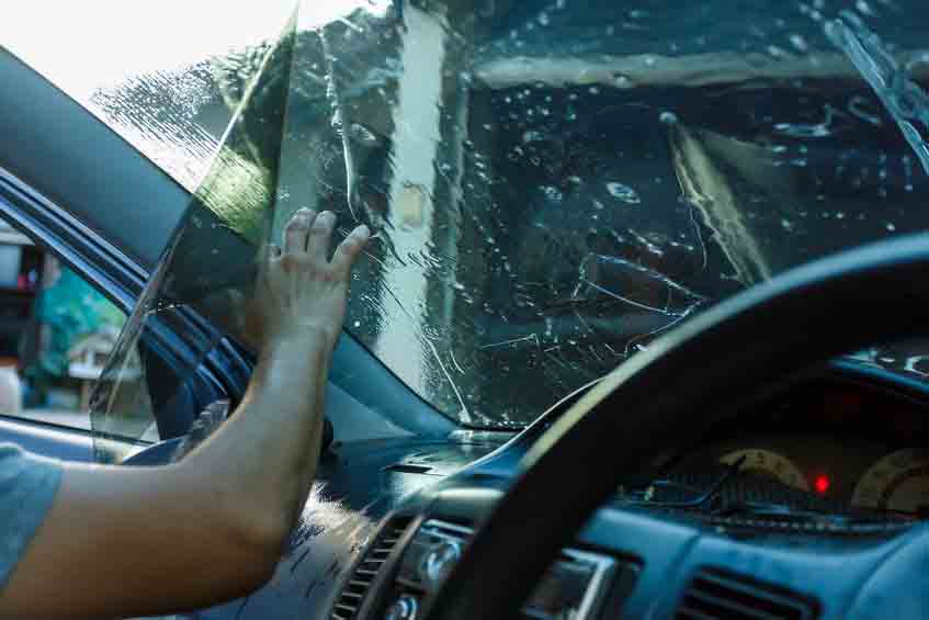 Car Films Installing windshield protection film blur.;